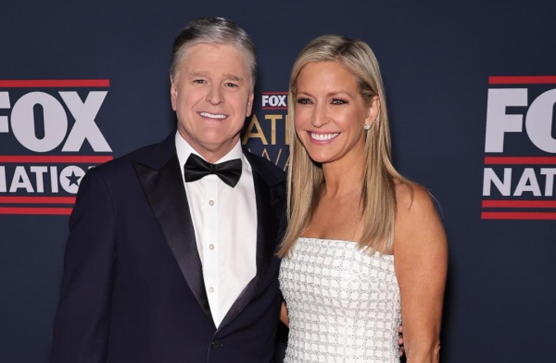 Fox News hosts Sean Hannity and Ainsley Earhardt engaged under the mistletoe